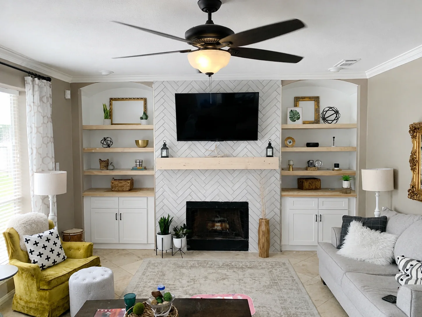 Custom living room built-ins and tiled fireplace renovation